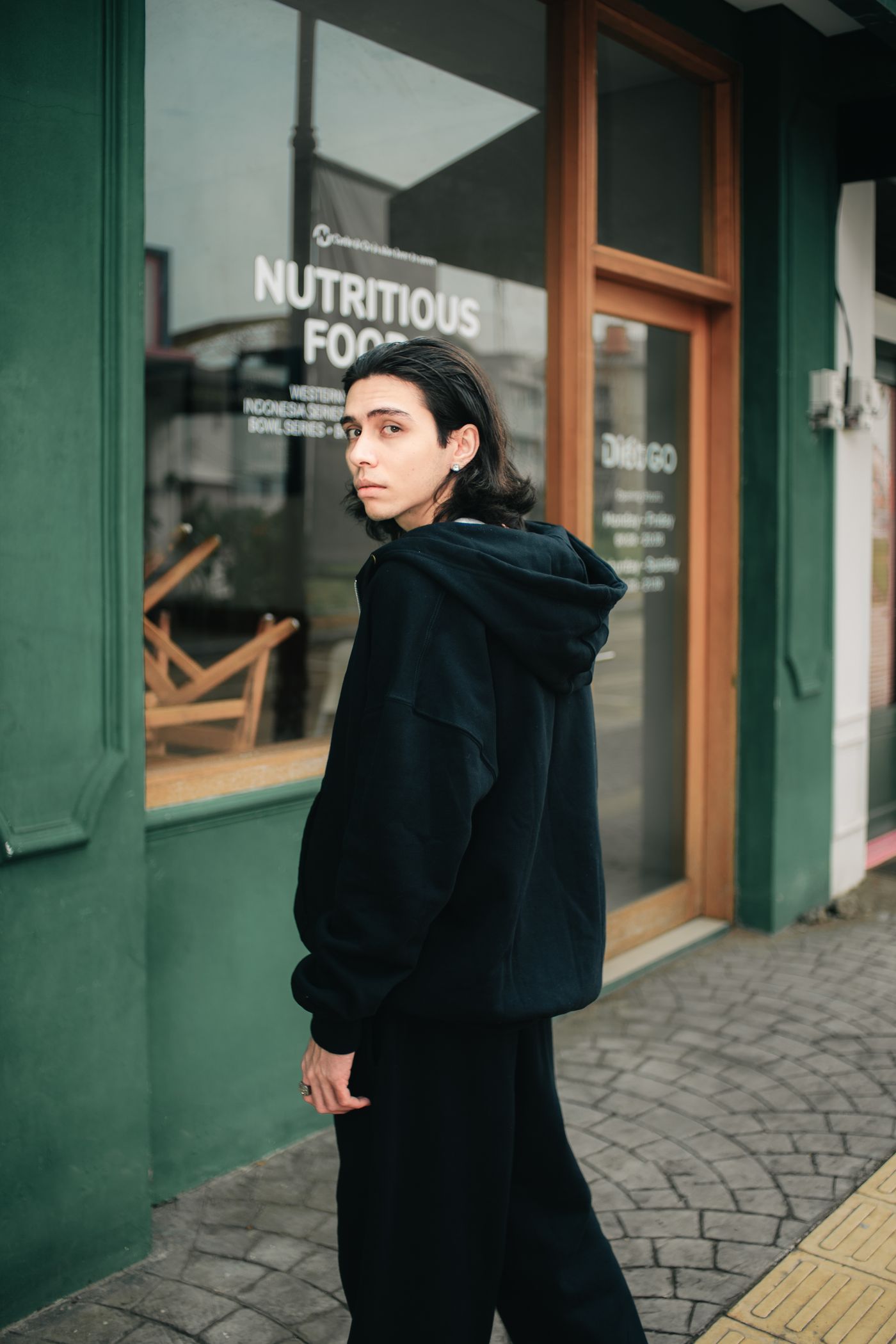 Monoloom Field Hood worn as a full dark outfit on the street