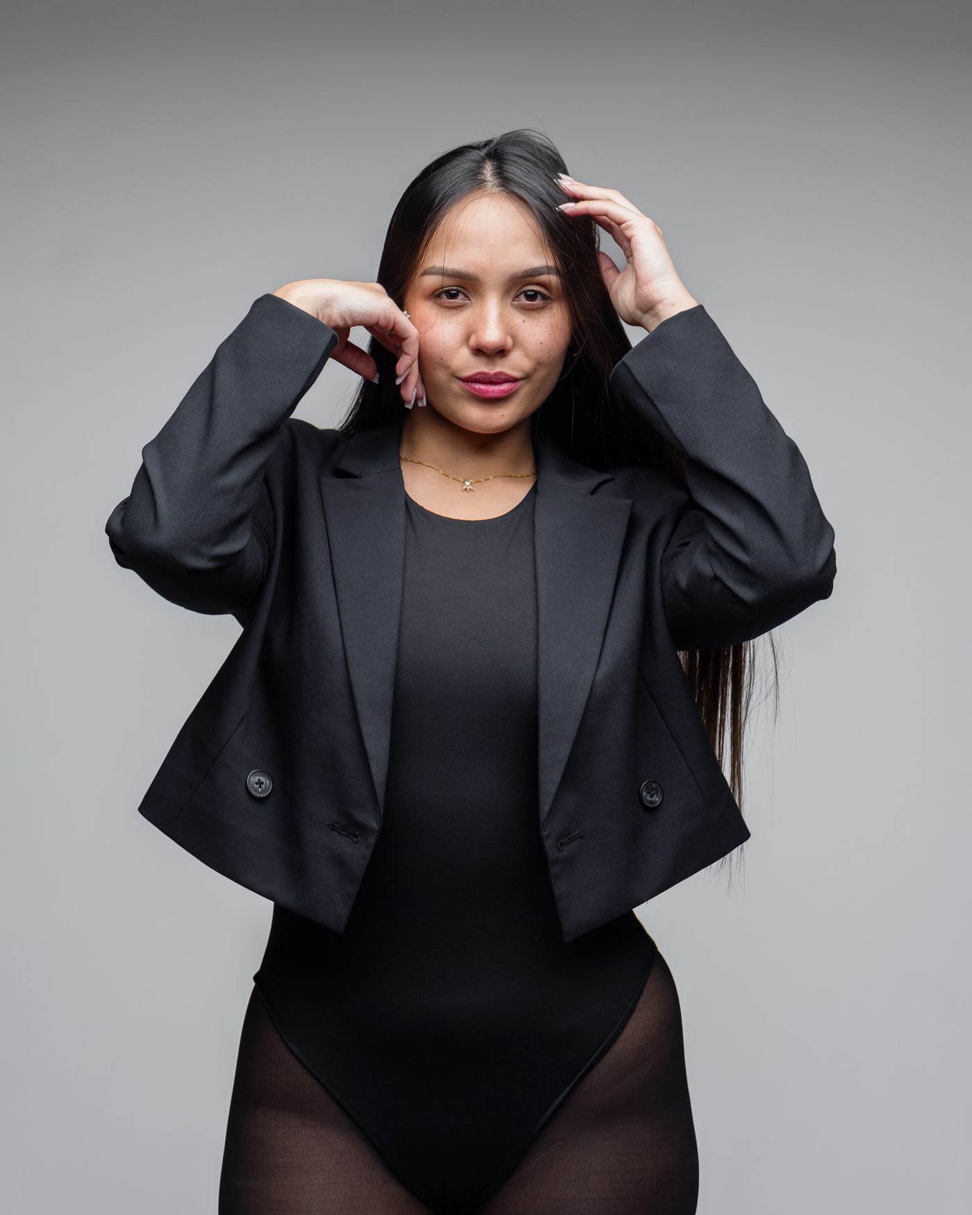 Monoloom Panel Jacket, a dark structured jacket shot in studio