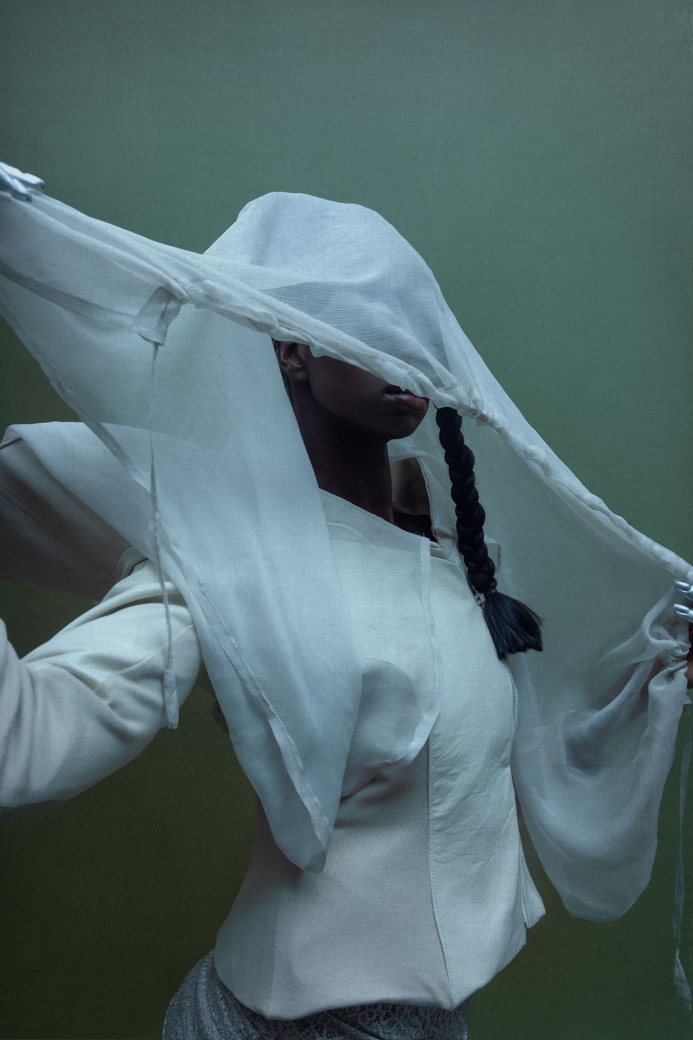Monoloom Veil Longsleeve, a sheer light layer caught mid-movement