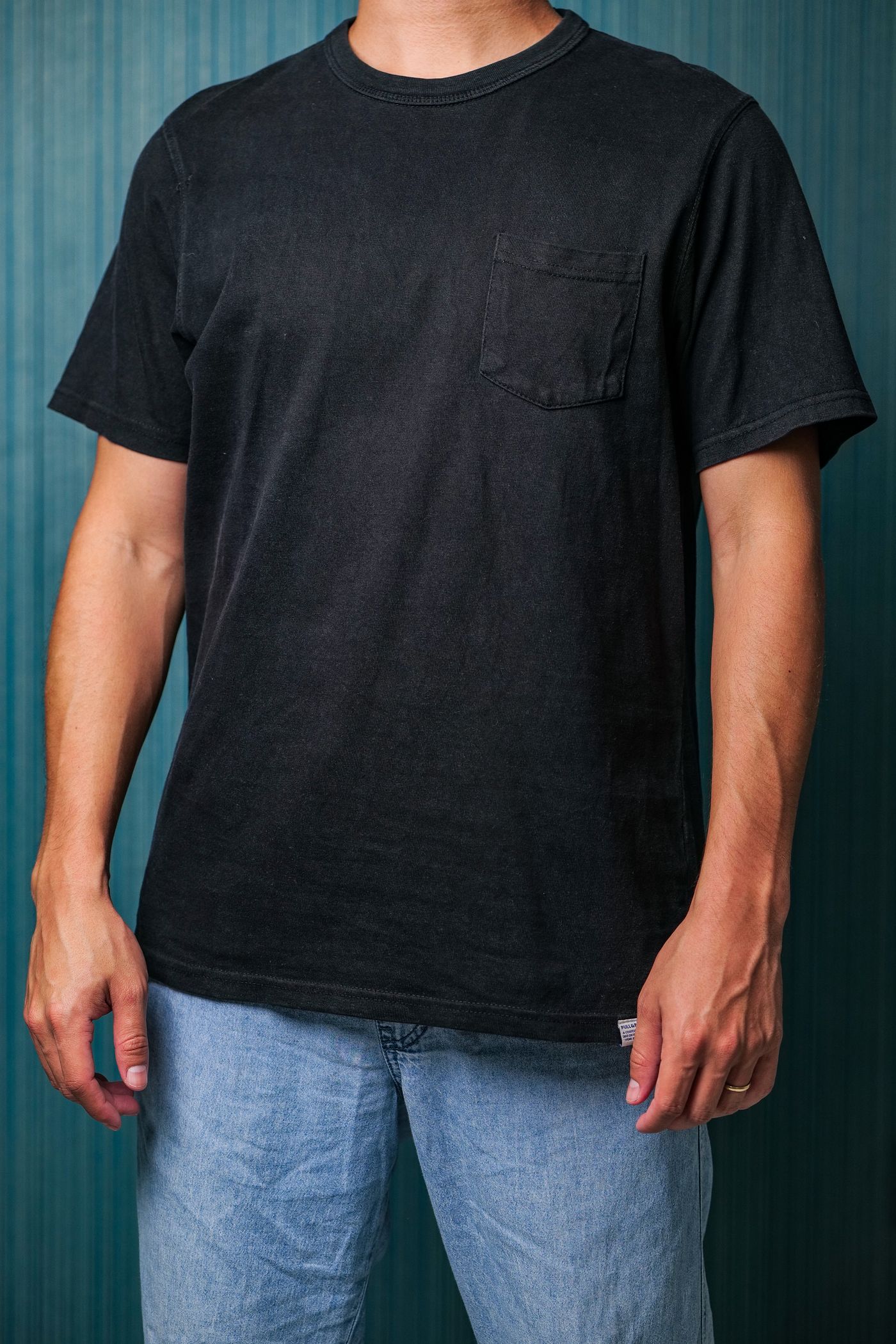 Monoloom Pocket Tee, a washed black tee with a single patch pocket